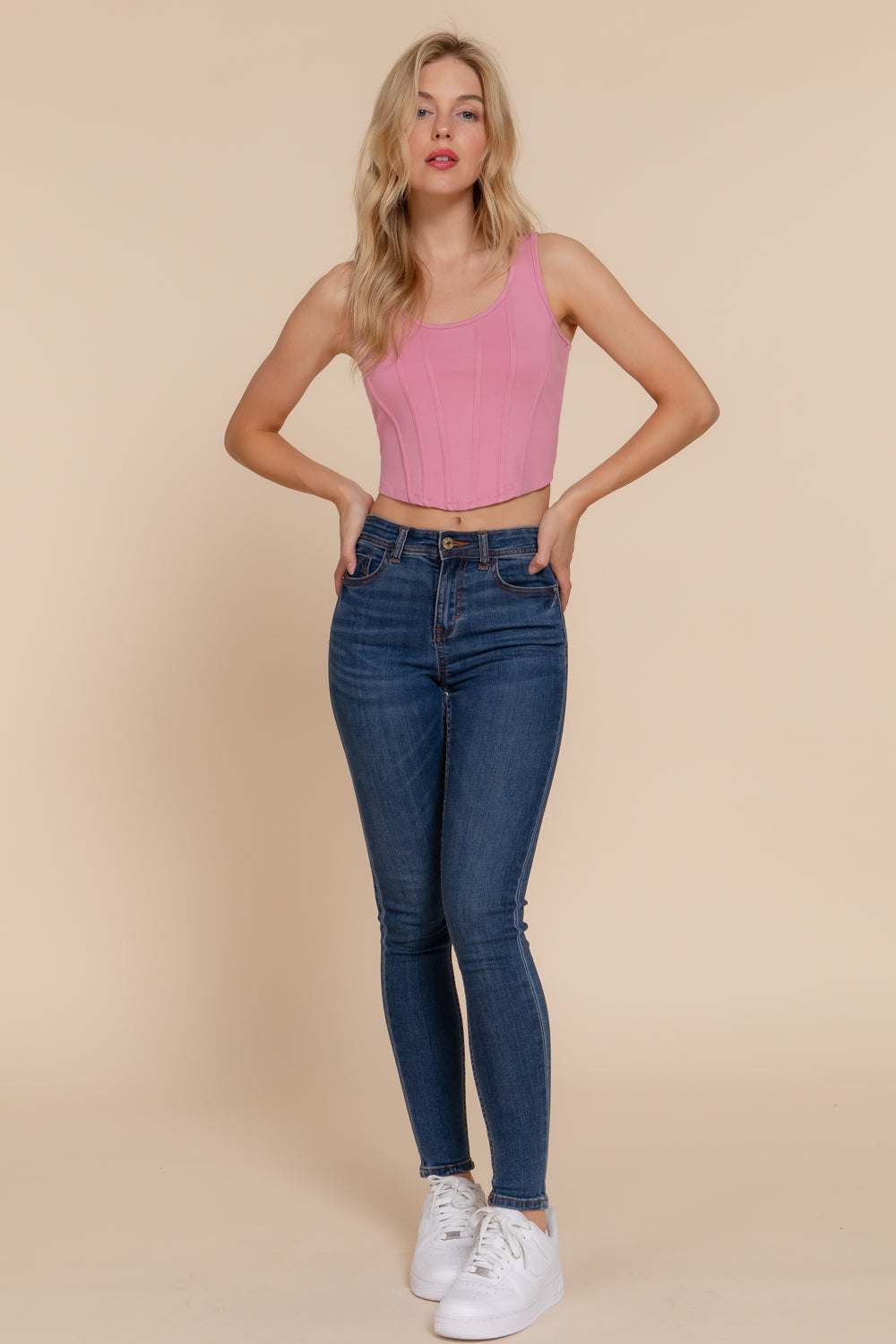 Pink knit tank top with curved hem